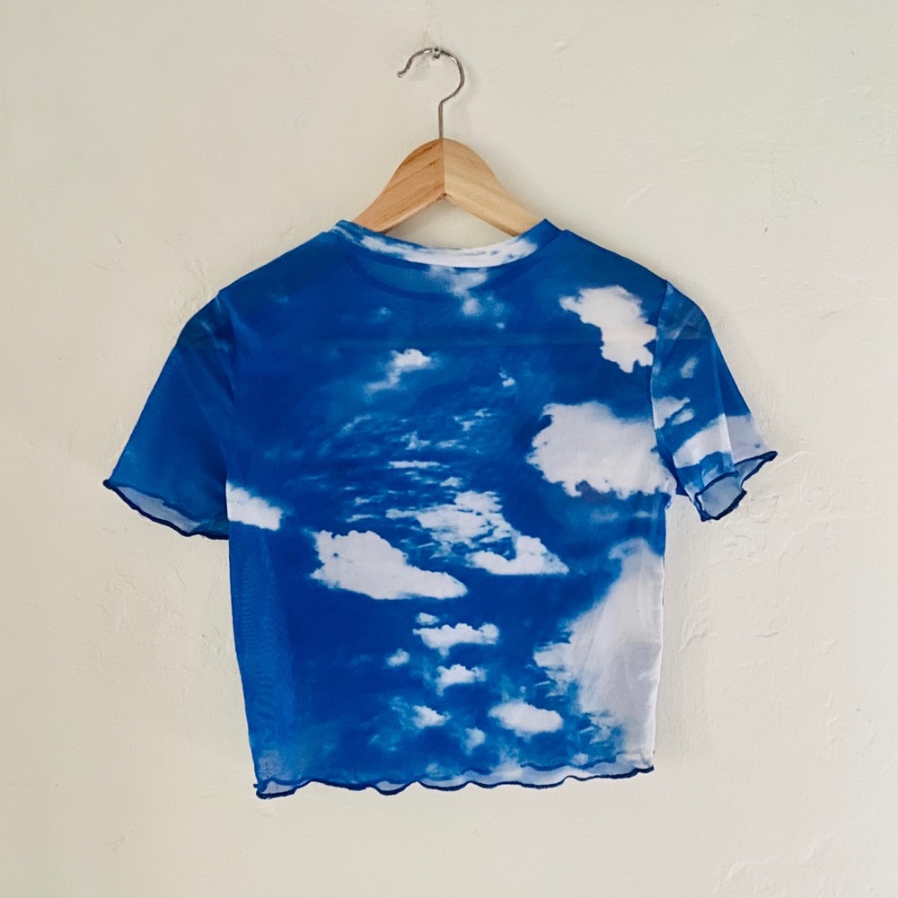 Sheer crop top with cloud pattern.